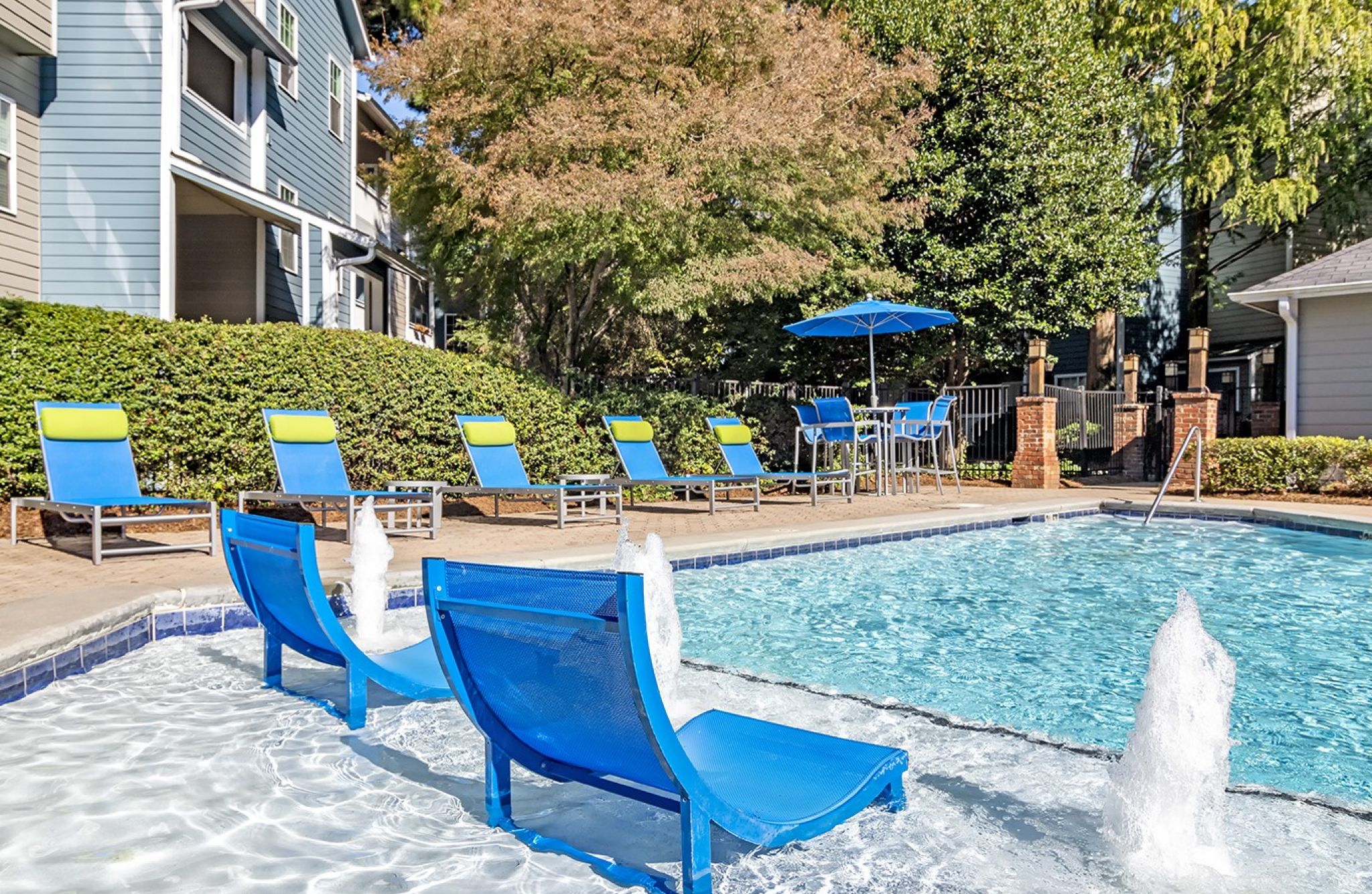 Hawthorne North Druid Hills luxury outdoor pool with in-pool lounge chairs and surrounding seating